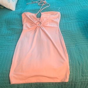 Fashion Nova dress new with tags Pink halter style with small cut outs.
